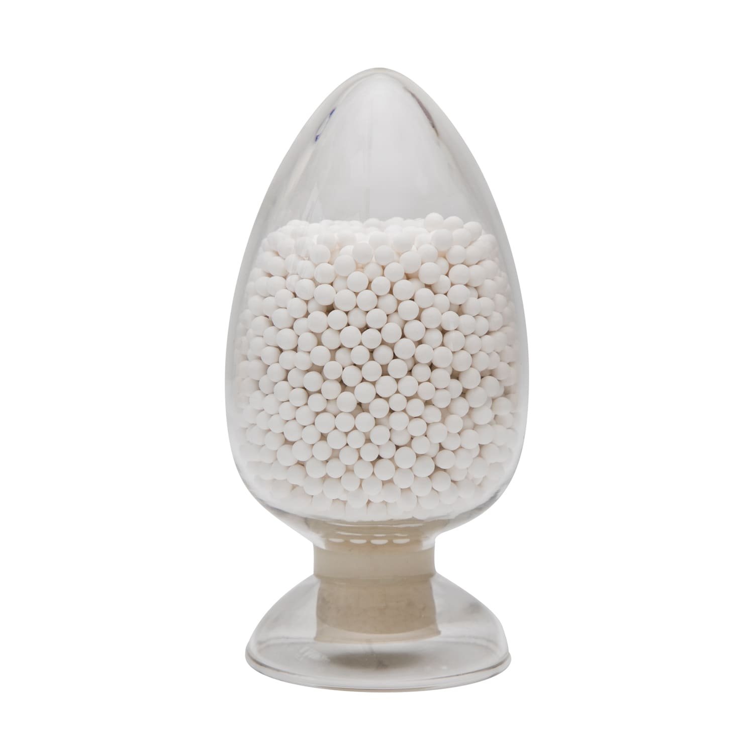 A close-up of durable activated alumina pellets in an industrial setting