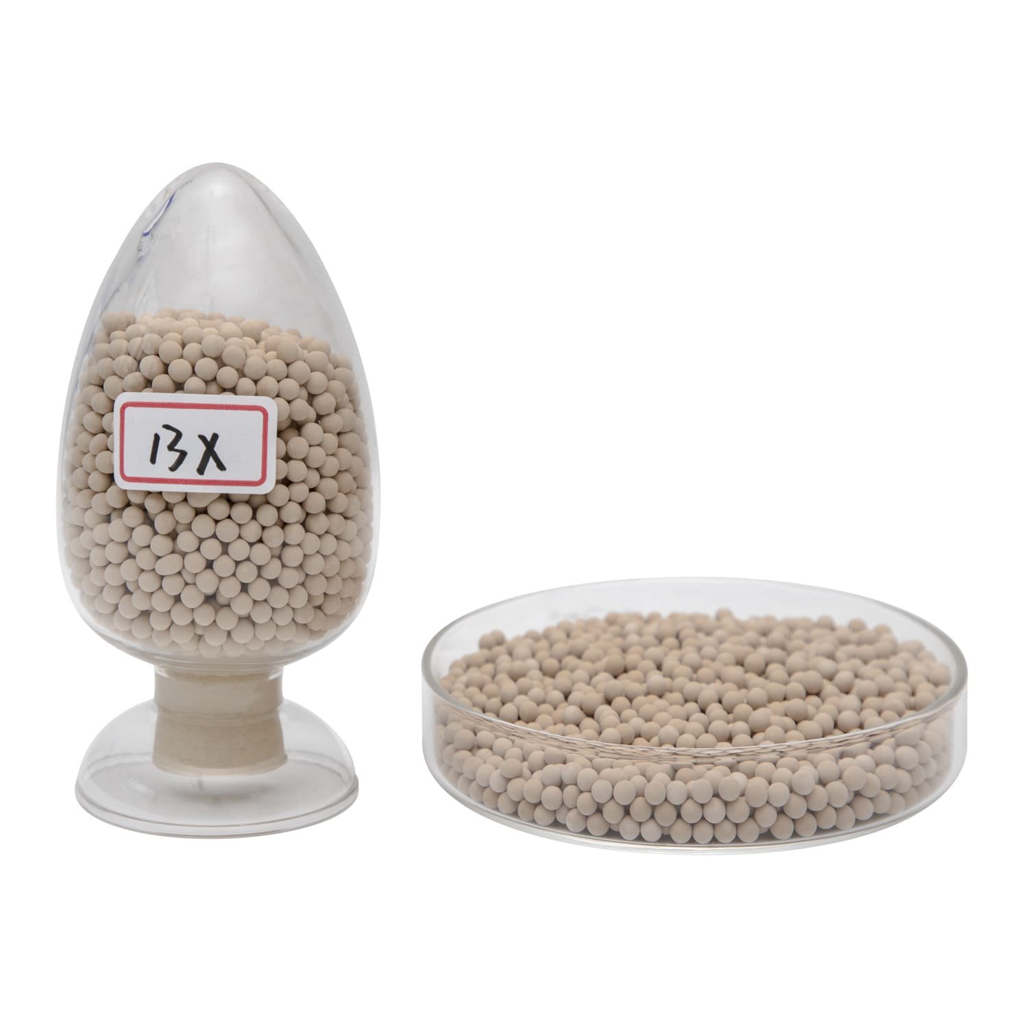 A worker inspecting a bag of 13X-HP molecular sieves