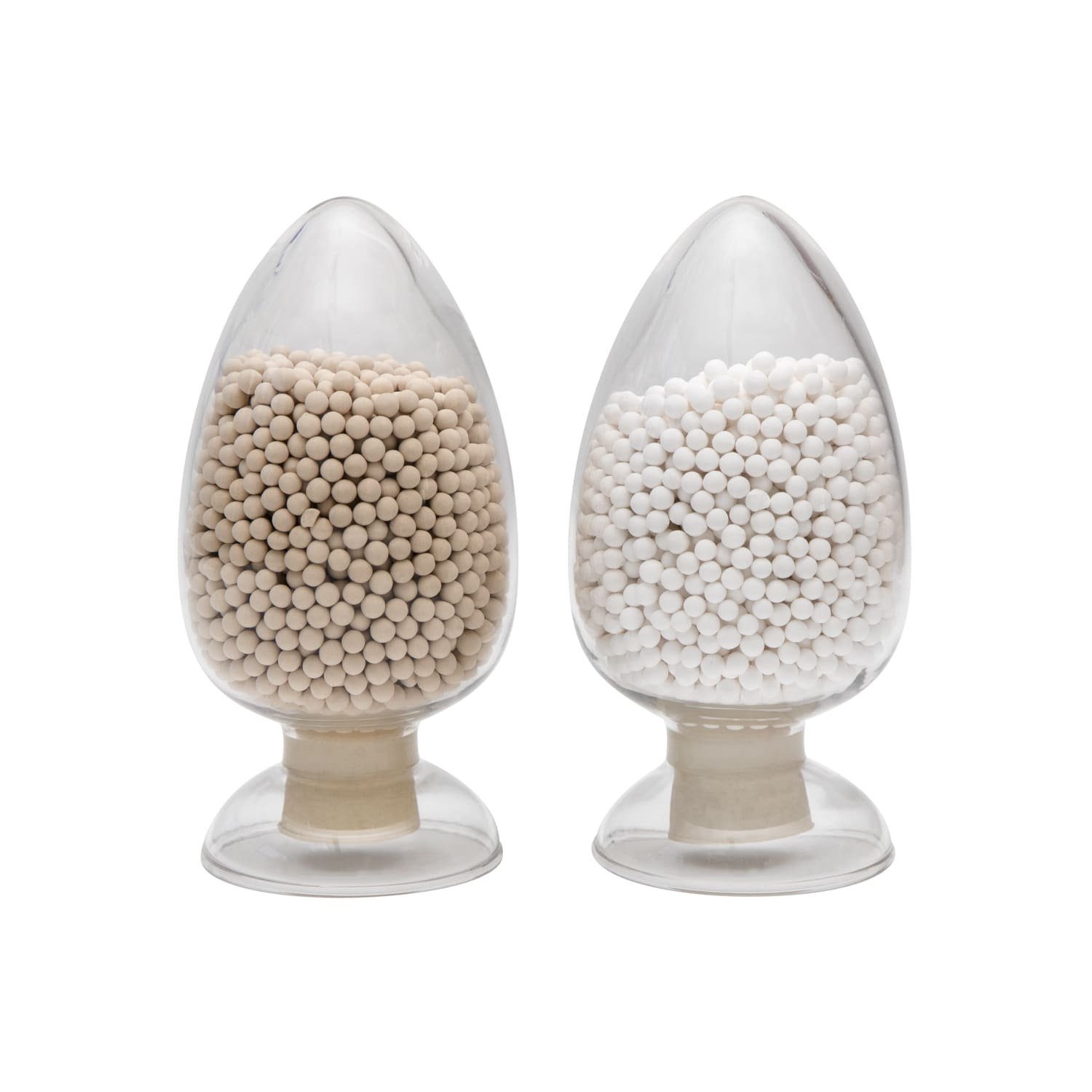 A side-by-side comparison of white molecular sieve beads and activated alumina spheres