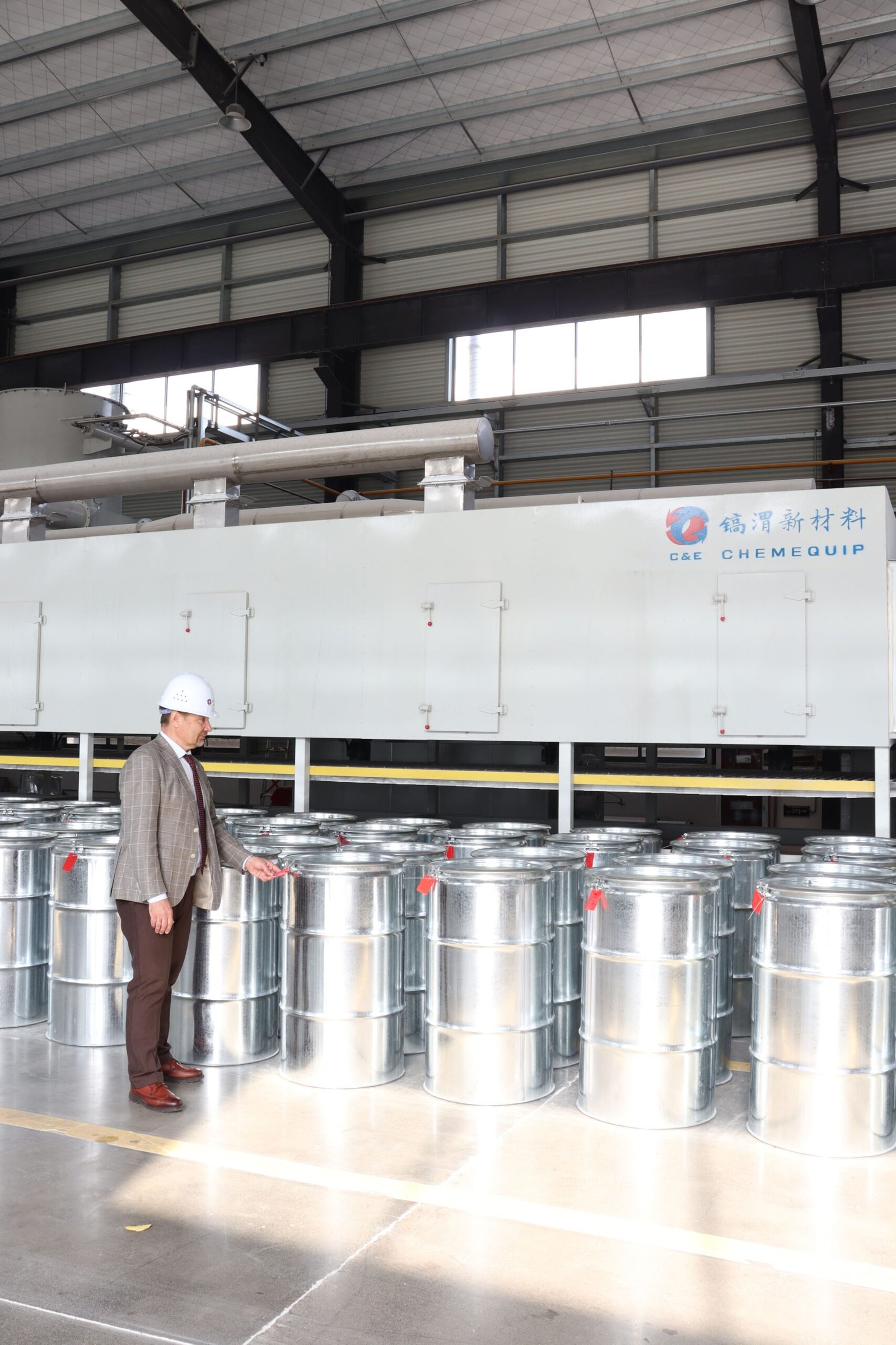 An industrial setup with pipes and pressure vessels, representing a molecular sieve system.