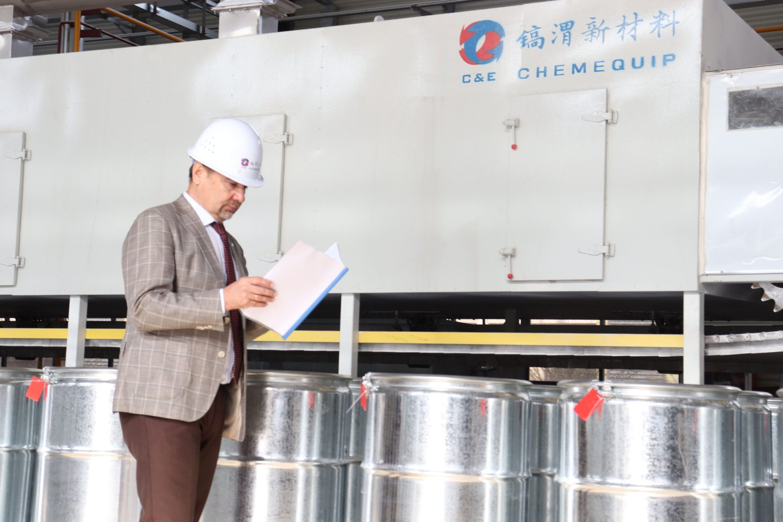 A technician inspecting the quality of molecular sieve beads.